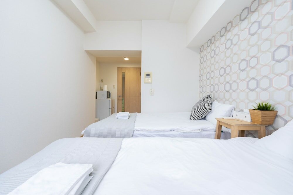 Фото Shinsaibash East Nana Apartment · Junan