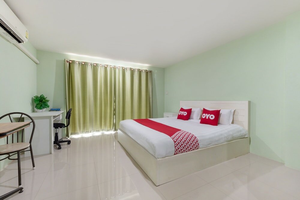 Фото Oyo 75363 V Place Apartment