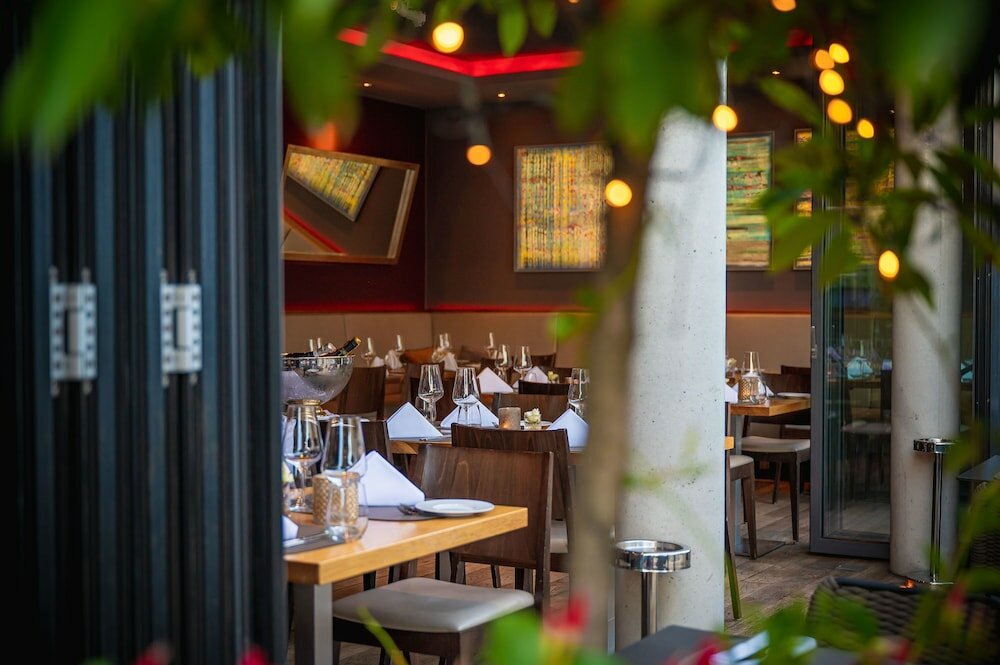 Фото Qube Hotel Bergheim