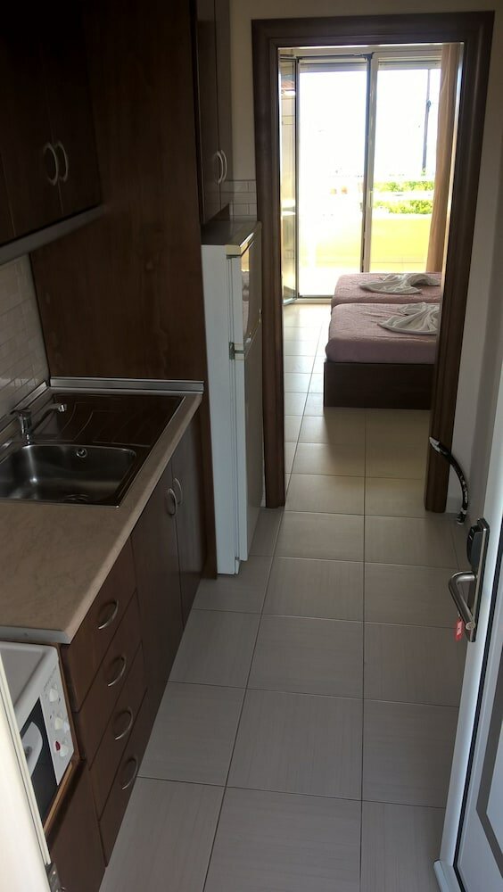 Фото Kyparissis Rooms