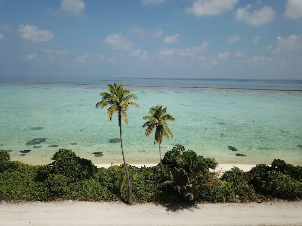 Фото Thoddoo Beach Holiday Inn