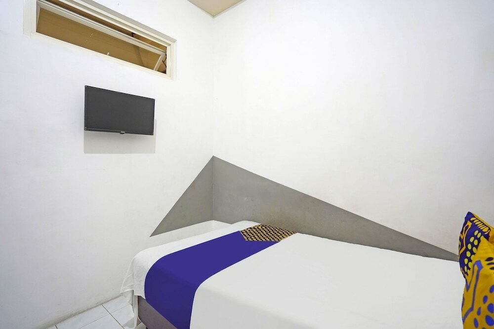 Фото Spot On 91360 Swk 68 Syariah