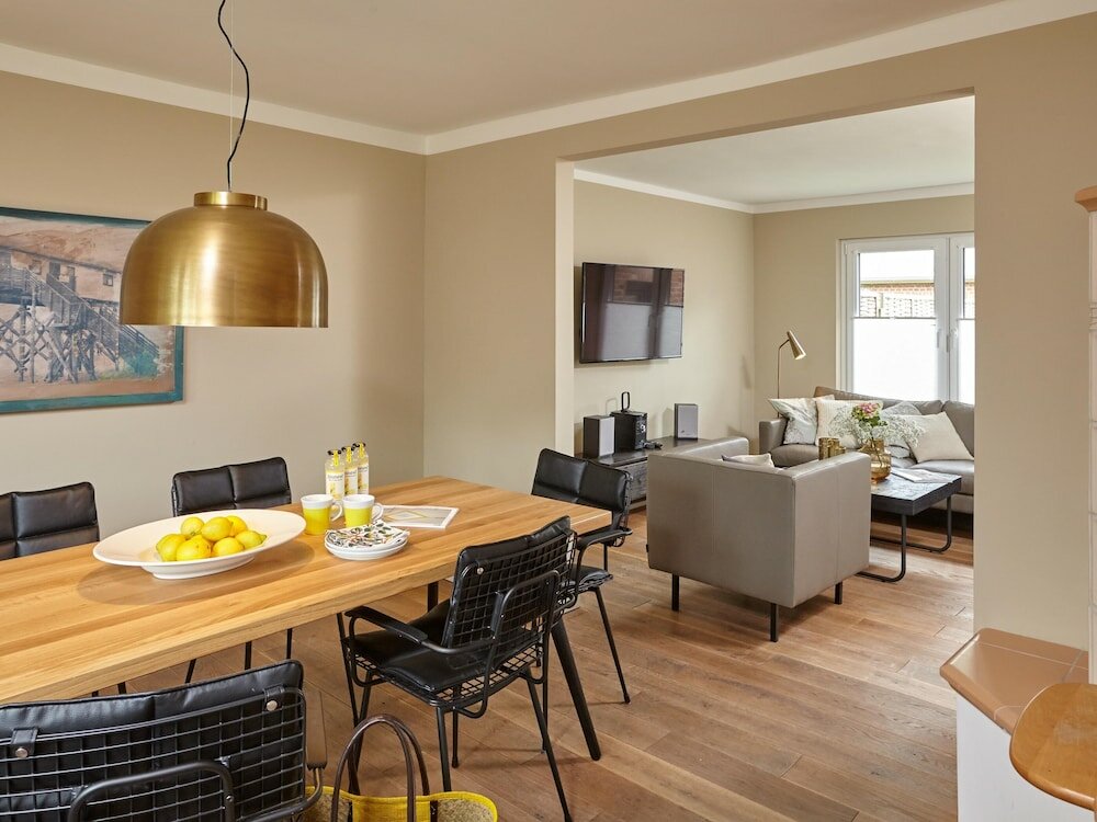 Фото Ferienhaus & Appartments Düneneck 8