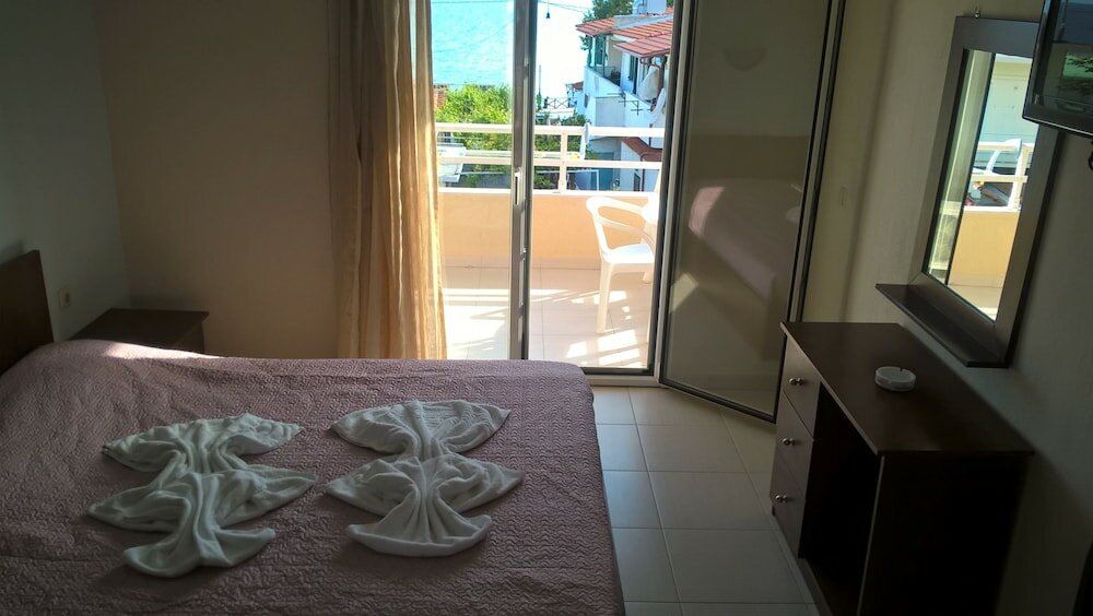 Фото Kyparissis Rooms