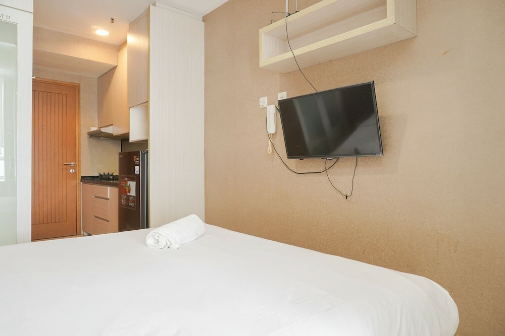 Фото Warm And Cozy Studio At Cinere Bellevue Suites Apartment