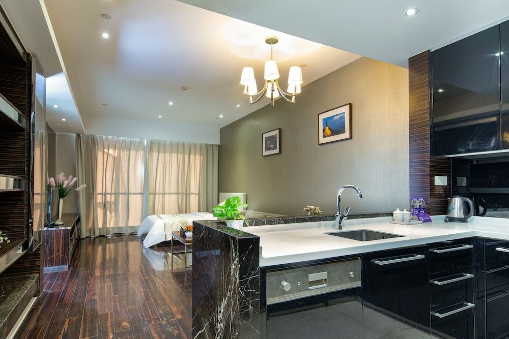 Фото Xingyi International Hotel Poly Store