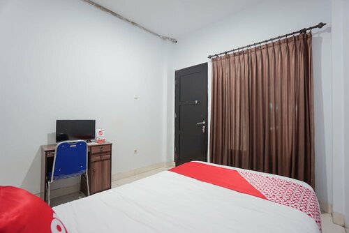 Гостиница Oyo 2566 Putri Kesia Rooms в Манадо