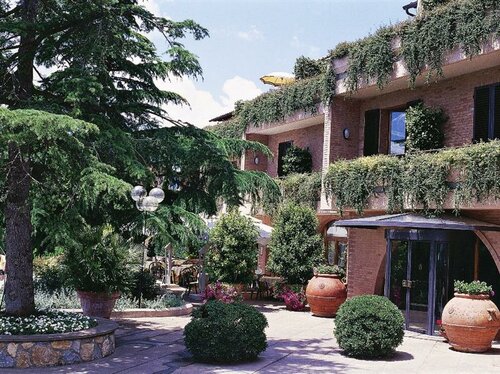 Внешний вид отеля Relais Santa Chiara Hotel в Сан-Джиминьяно, фото 5