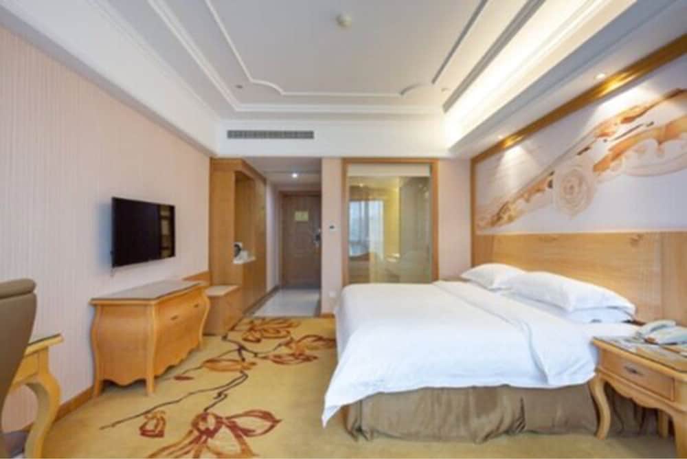 Фото Vienna International Hotel - Ningbo City West Xintiandi