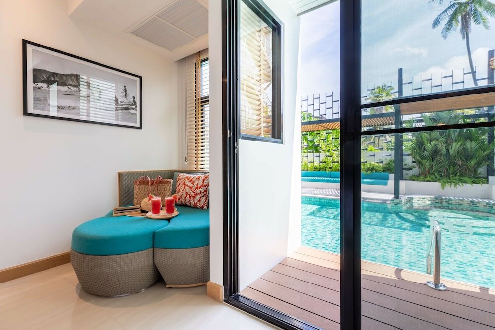 Фото Outrigger Surin Beach Resort