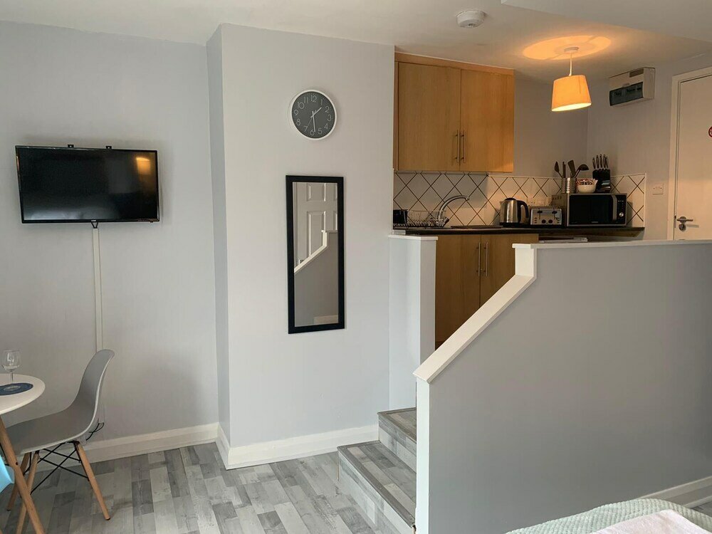 Фото Grey Stone Studio Apartments