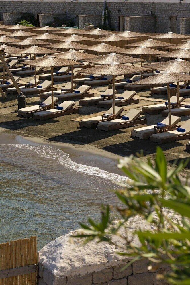 Фото Mandraki Beach Resort - Adults Only