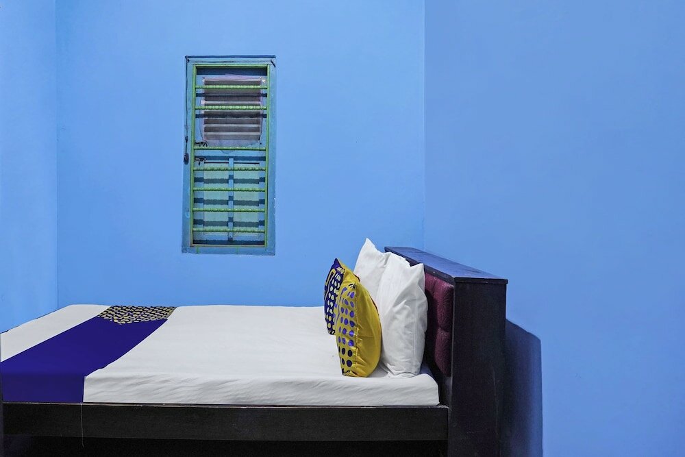 Фото Spot On 91859 Kost Budhe Syariah