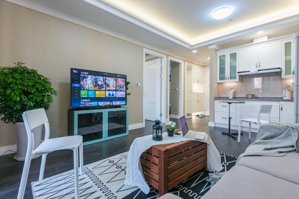 Фото Shanghai Xinchuan Boutique Apartment