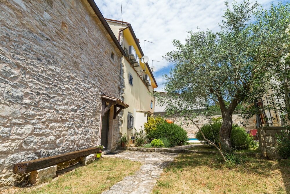 Фото Especially charm stone house with a pool