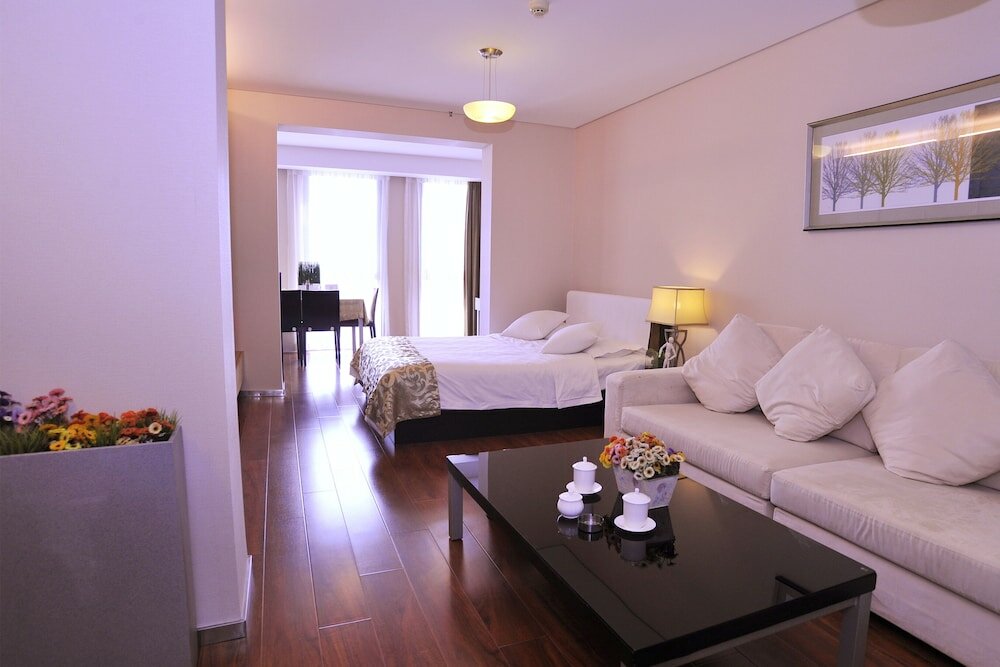 Фото Qingdao Housing International Hotel