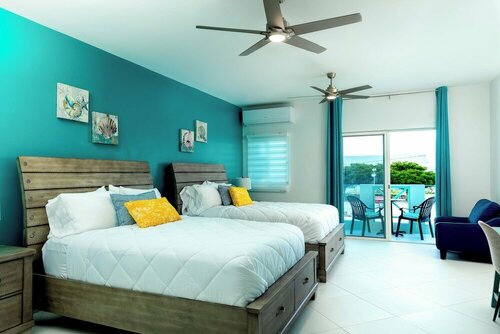 Гостиница The Suites at Mr Grouper