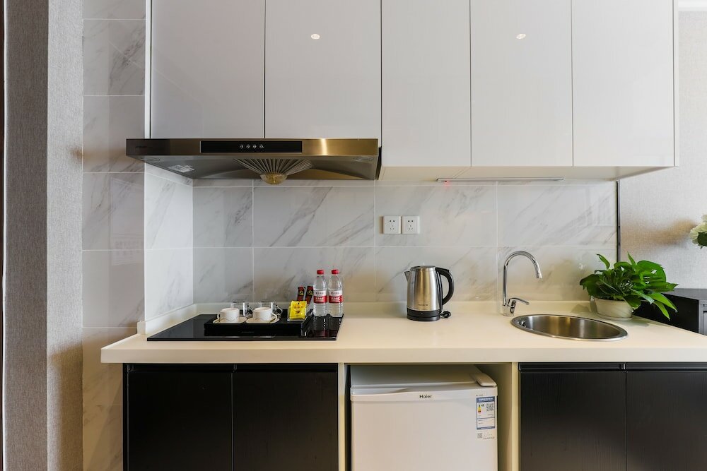 Фото Yue Qi Hotel Apartment