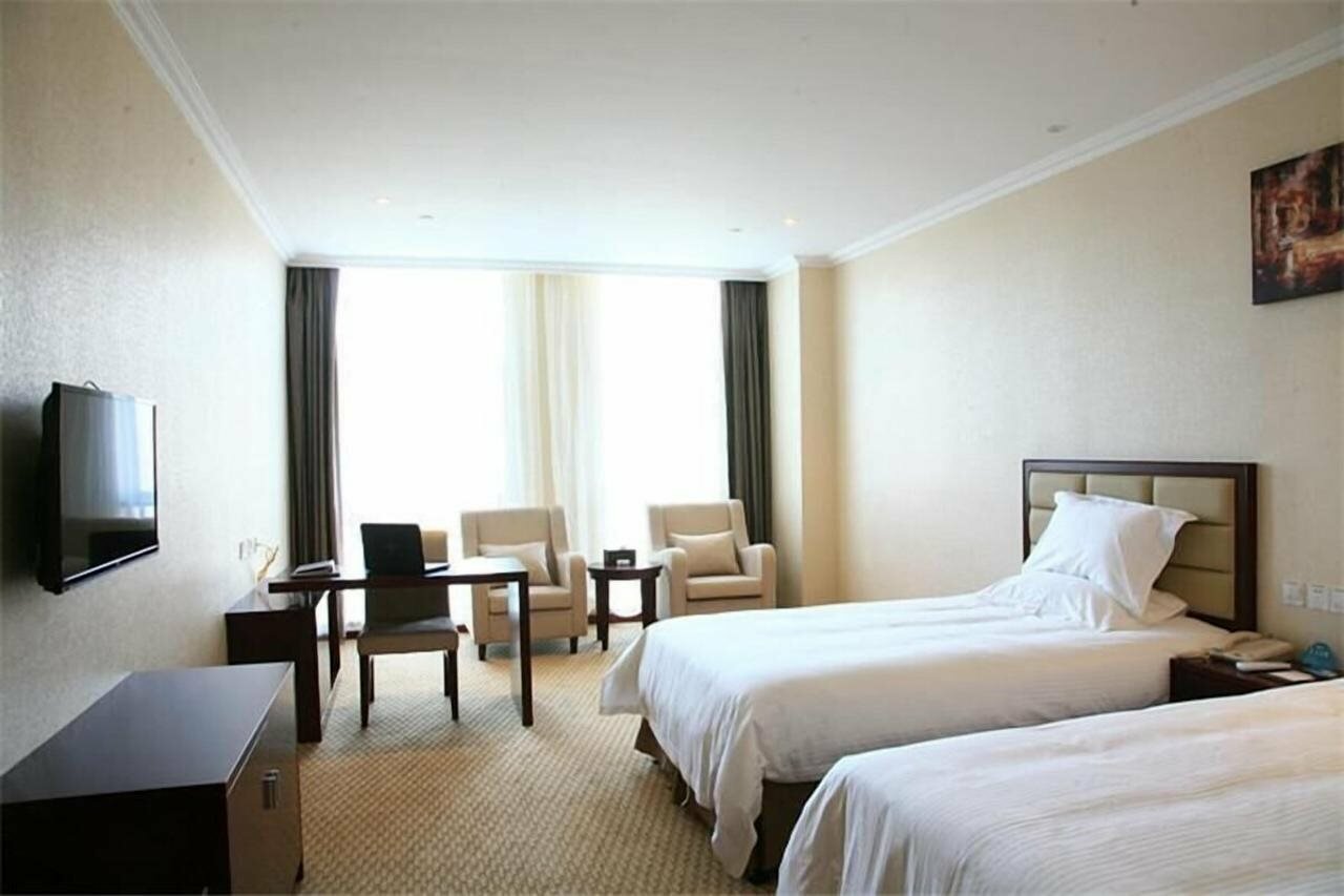 Фото GreenTree Inn Shaoxing Keqiao Xingyue Road Zhongqing Building Hotel