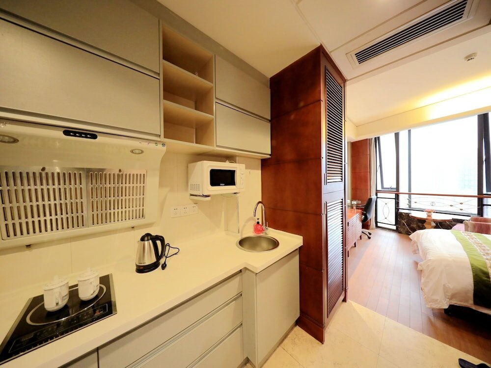 Фото Nanchang Honggutan Taili Apartment