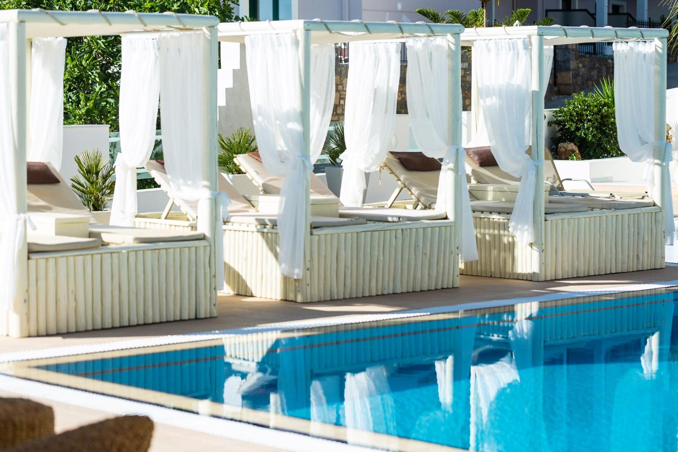 Фото Nostos Beach Boutique Hotel