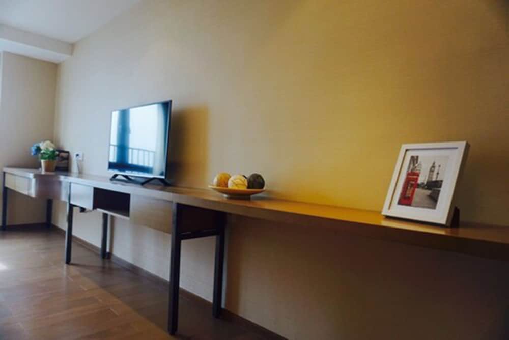 Фото Yuwa Serviced ApartHotel