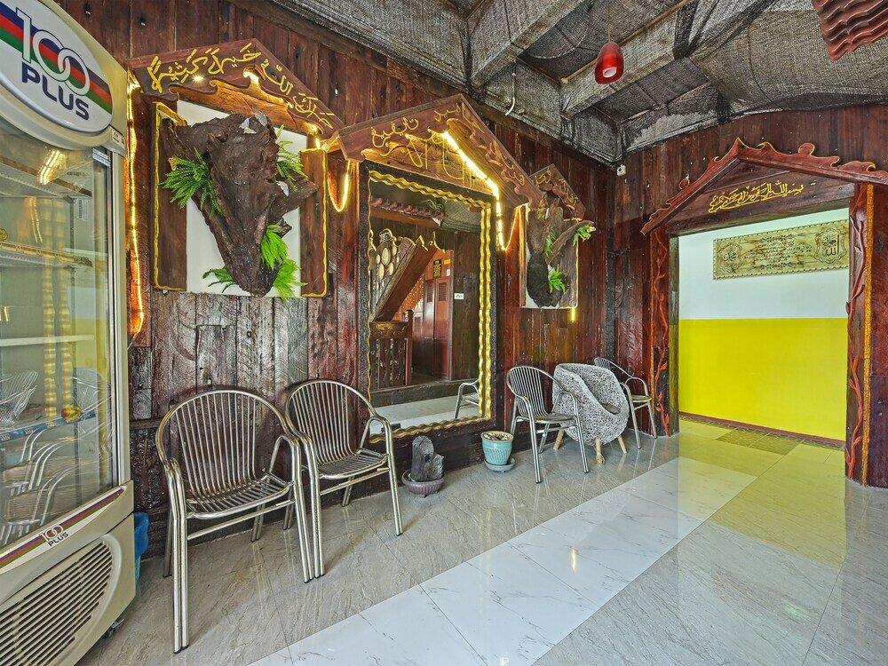 Фото Super Oyo Capital O 90659 Raintown Timbers Hotel