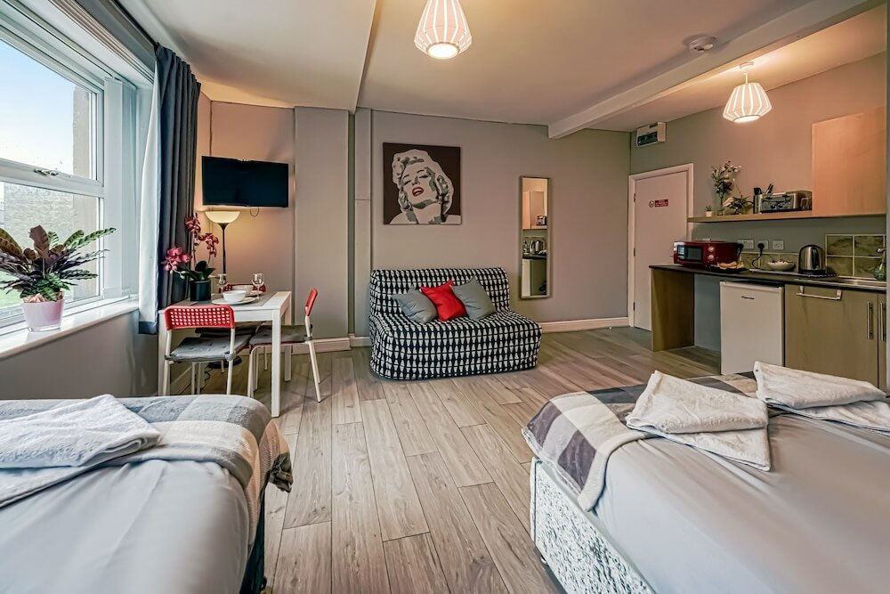 Фото Grey Stone Studio Apartments