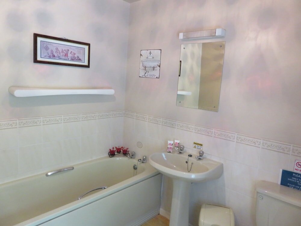 Фото The Coach House Self Catering Apartments