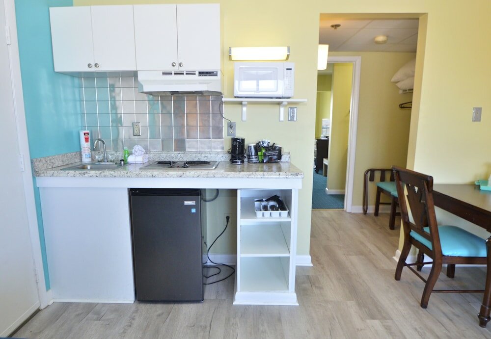 Фото Cayman Suites Hotel