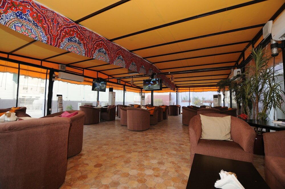 Фото Al Muhanna Plaza Hotel