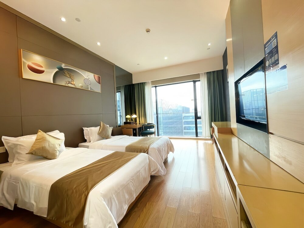 Фото Xingyi International Hotel Poly Store