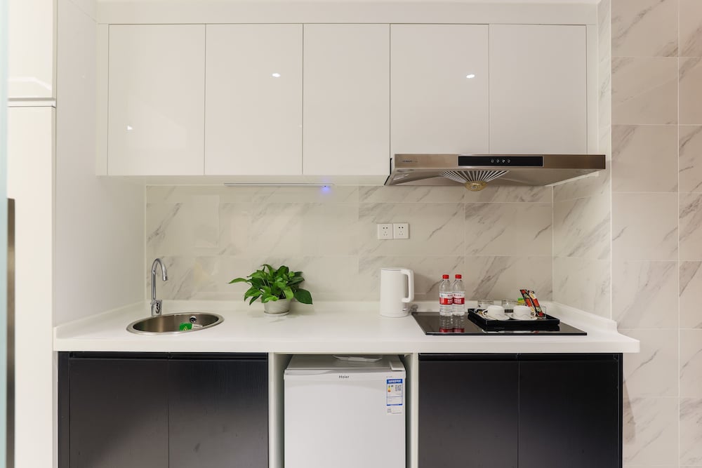 Фото Yue Qi Hotel Apartment