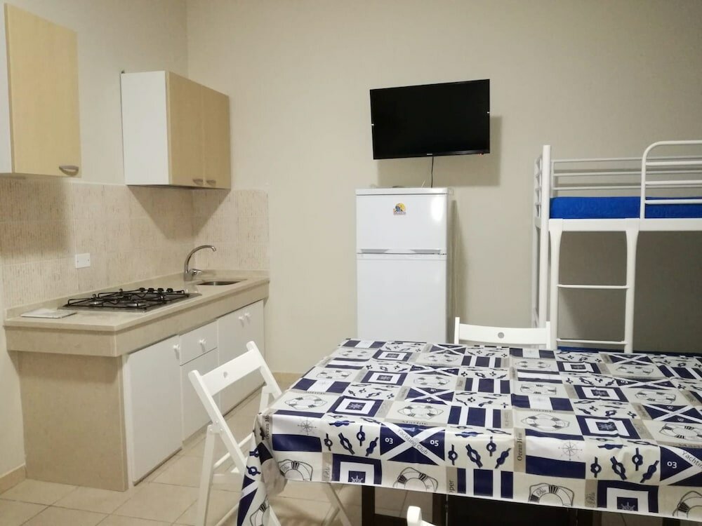 Фото Appartamenti La Caletta