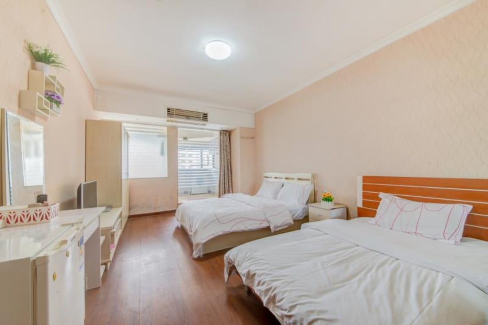 Фото Shenzhen Xinjia Business Apartment