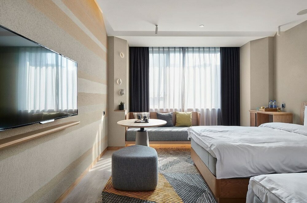 Фото Ebo Hotel Hangzhou Wulinmen