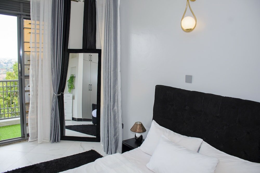 Фото Cozy Oasis Kyanja