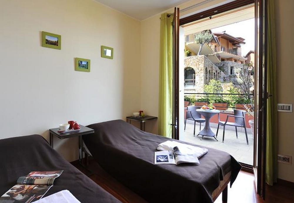 Фото La Perla Di Sonenga - Giardino