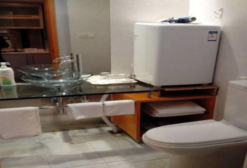 Фото Shanghai Yueyi Apartment Hotel