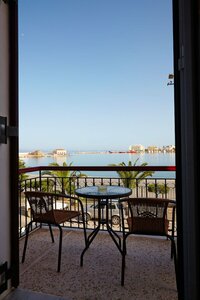 Гостиница Aegean Sea Rooms and Suites