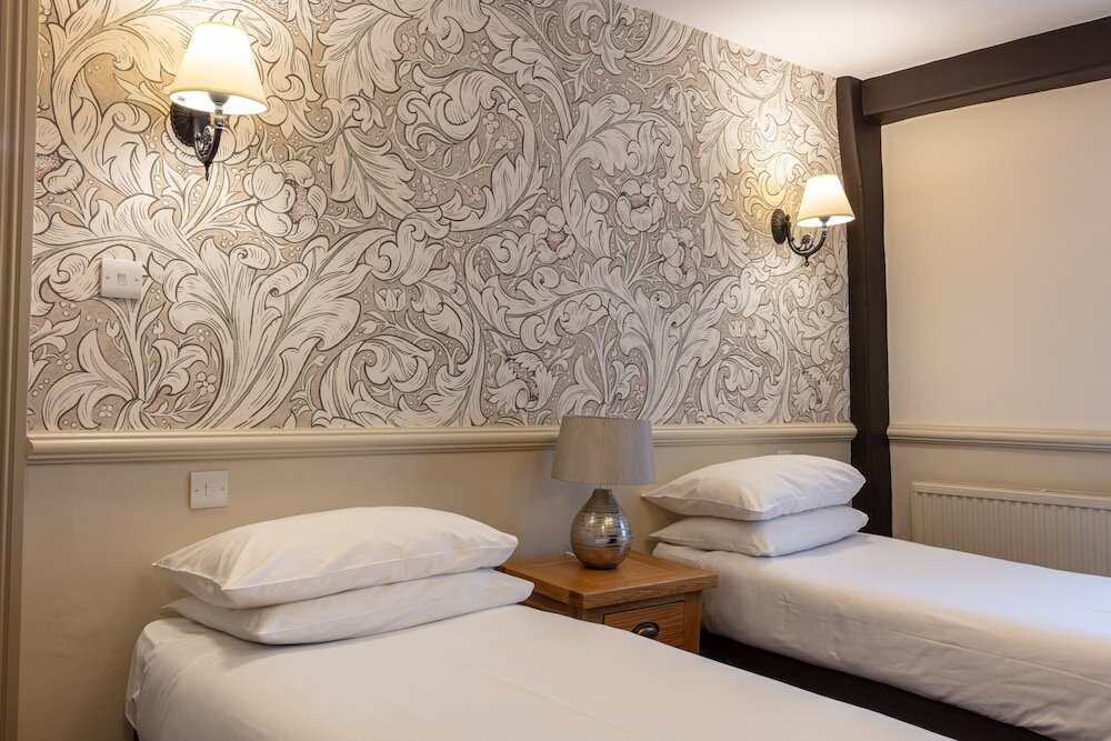 Фото The New Inn by Roomsbooked