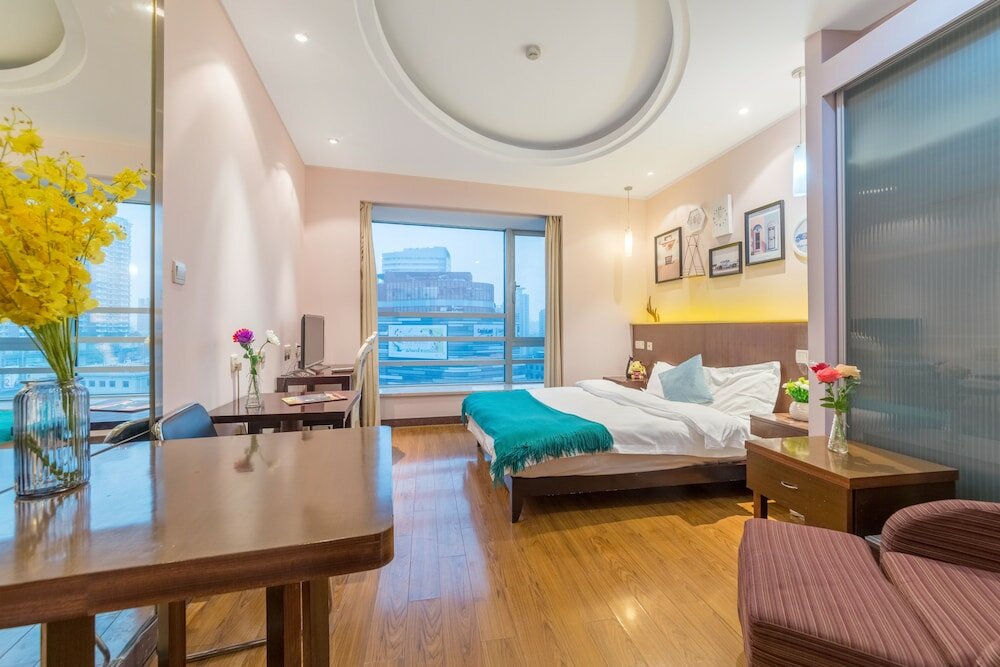 Фото Shanghai Yueyi Apartment Hotel