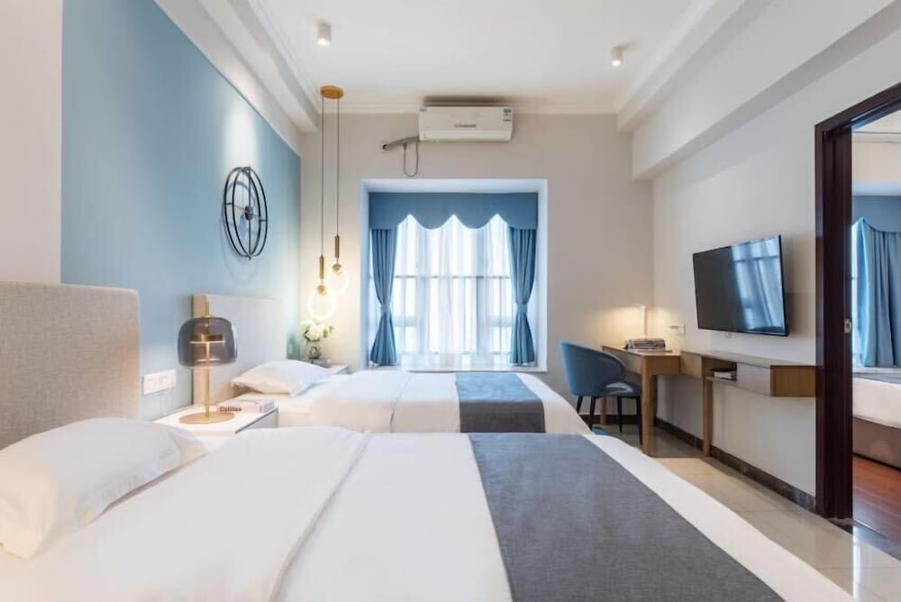 Фото Guangzhou Yi Long International Apartment