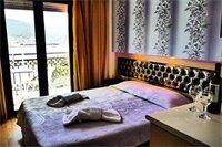 Фото Captain's Beach Boutique Apartments