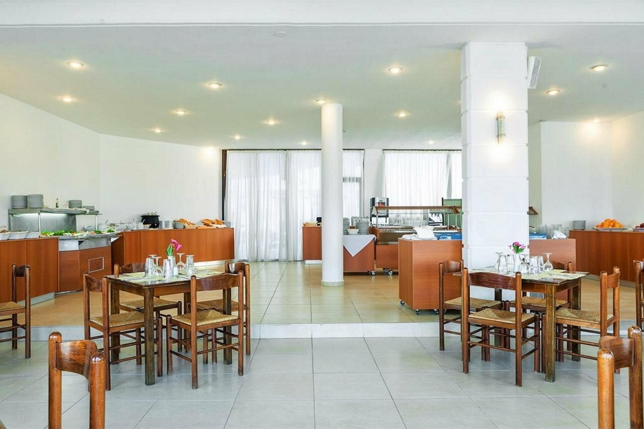 Фото Xenios Dolphin Beach Hotel