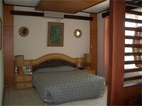 Фото Puri Naga Beachfront Cottages