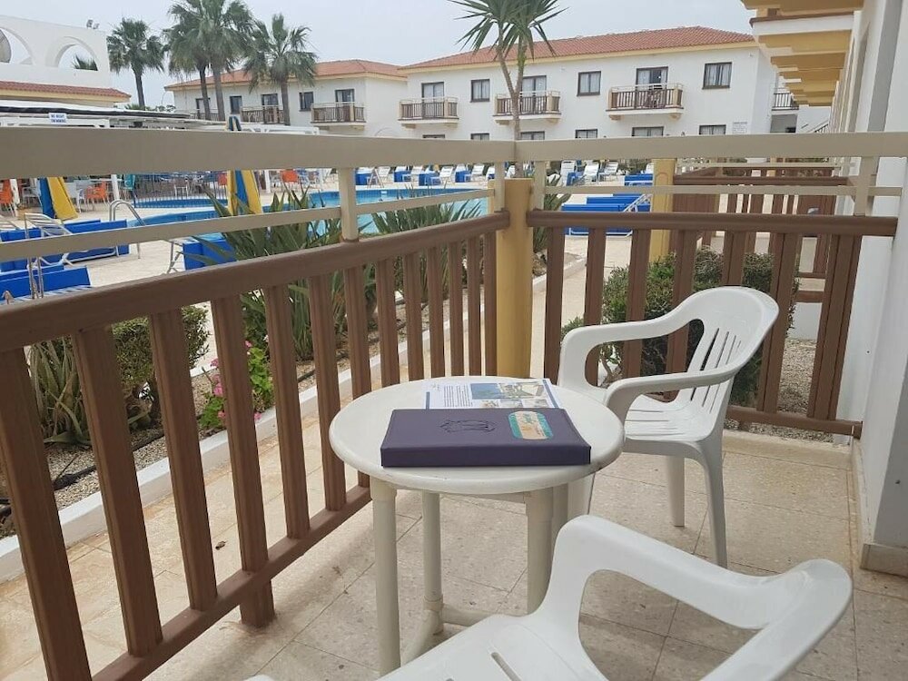 Фото Cosmelenia Hotel Apartments