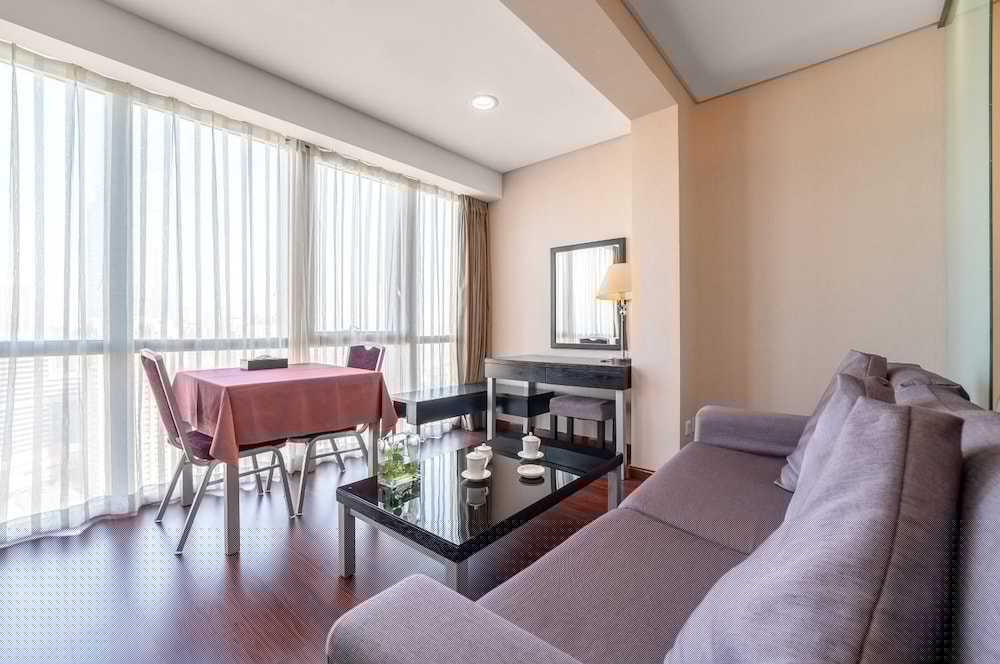 Фото Qingdao Housing International Hotel