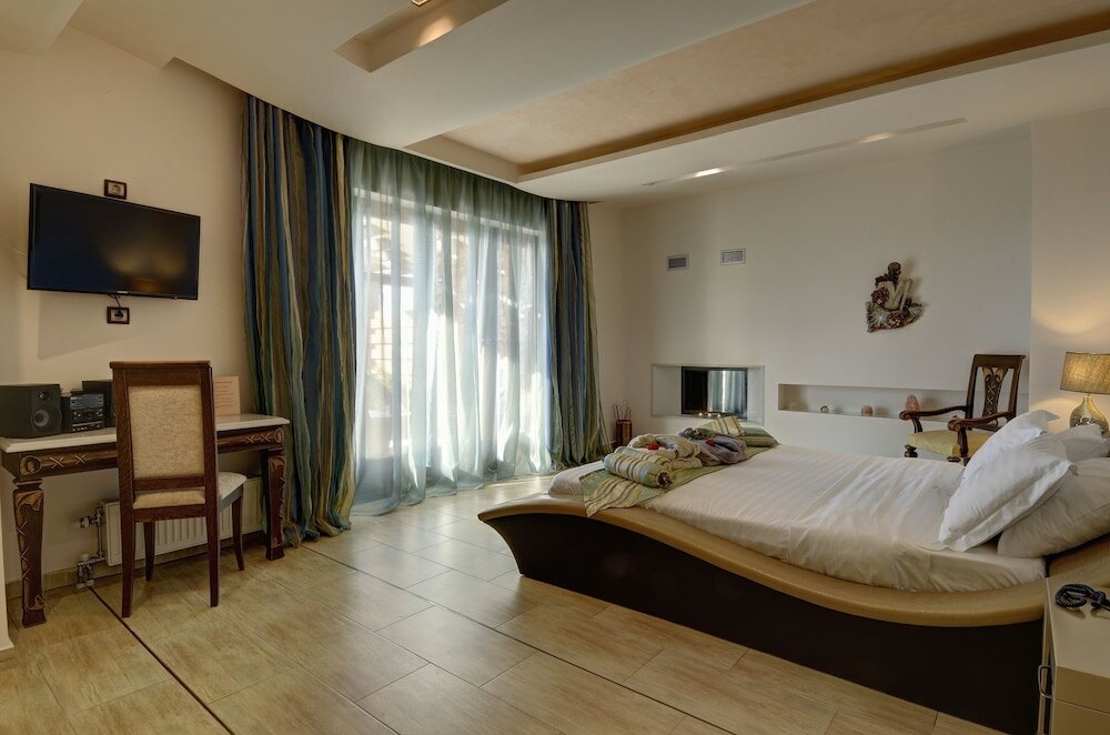 Фото Iakovakis Suites & SPA