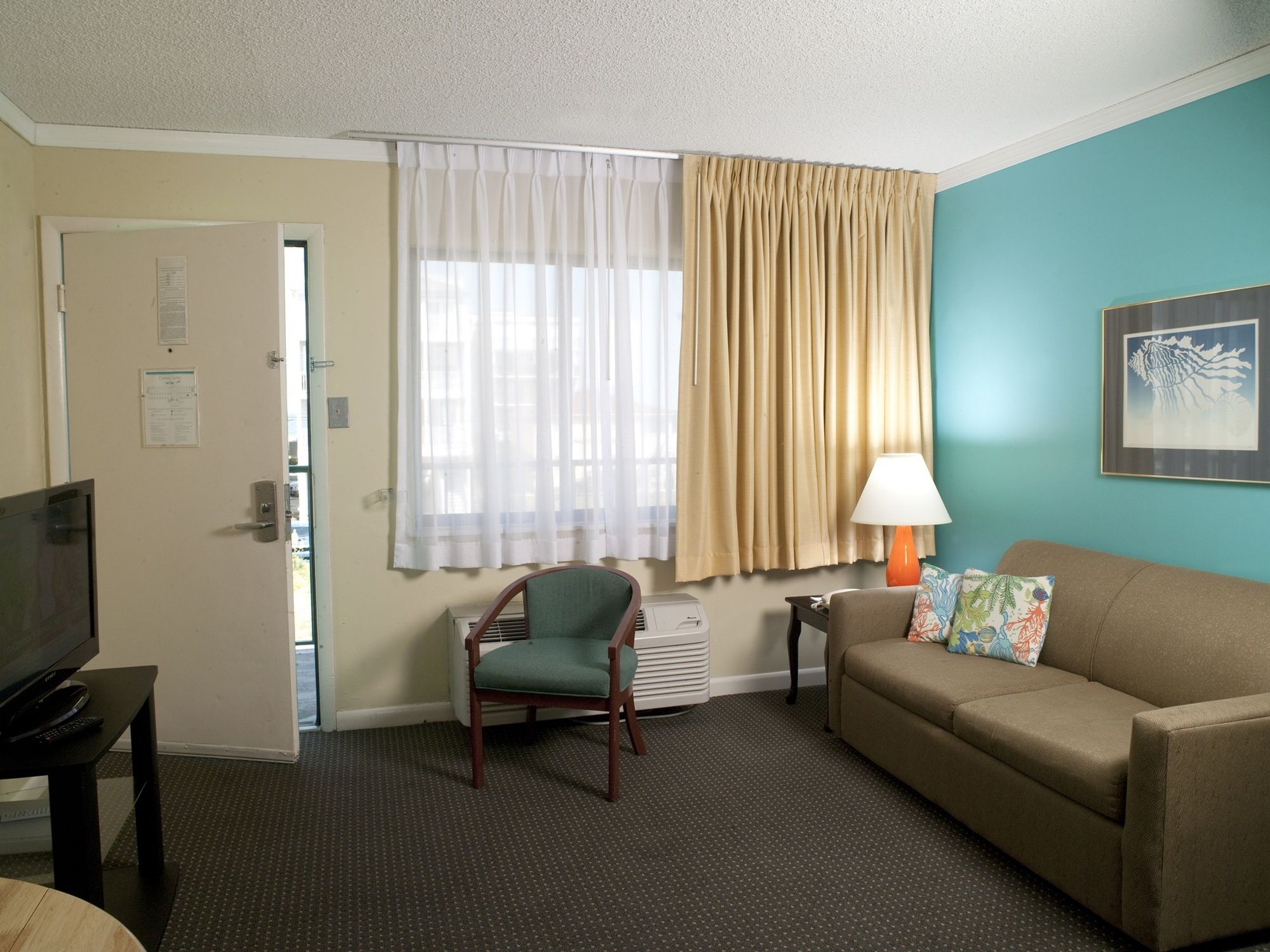 Фото Cayman Suites Hotel